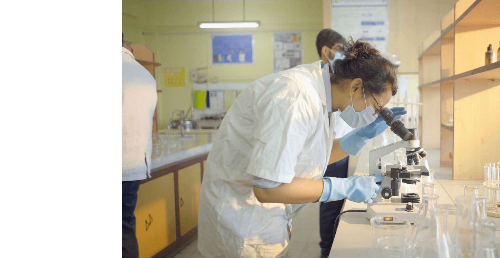 GNIPST pharmacy students conducting research in the laboratory